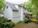 A full view of the back exterior, showing the deck, white siding, and partial basement at 2262 Silver Fox Ln, Buford, GA 30519
