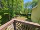 Relaxing backyard view from the deck features a wooded area, and lawn at 2262 Silver Fox Ln, Buford, GA 30519