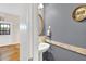 Powder room with pedestal sink and mirror at 2262 Silver Fox Ln, Buford, GA 30519