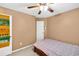 Neutral bedroom featuring a ceiling fan, carpeted floors, and a tapestry over the door at 2262 Silver Fox Ln, Buford, GA 30519