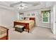 Main bedroom featuring trey ceilings, a ceiling fan and carpeted floors at 2262 Silver Fox Ln, Buford, GA 30519