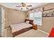 Bedroom with ceiling fan, window, and carpeted floor at 2262 Silver Fox Ln, Buford, GA 30519