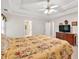 Main bedroom featuring trey ceilings, a ceiling fan, ensuite bathroom and carpeted floors at 2262 Silver Fox Ln, Buford, GA 30519