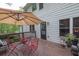 Outdoor deck features a dining table and chairs, plus views of the backyard and greenery at 2262 Silver Fox Ln, Buford, GA 30519