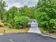 Beautiful home on a cul-de-sac featuring a well-manicured lawn, an attached two-car garage, and mature trees at 2262 Silver Fox Ln, Buford, GA 30519