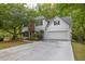 Charming two-story home featuring an attached two-car garage, brick accents, and a well-manicured lawn at 2262 Silver Fox Ln, Buford, GA 30519