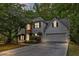 The home features a well-maintained lawn, a brick facade, and an attached two-car garage at 2262 Silver Fox Ln, Buford, GA 30519