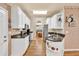 Traditional kitchen with white cabinets, stainless steel appliances, granite countertops, and eat-in kitchen at 2262 Silver Fox Ln, Buford, GA 30519