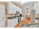 Spacious kitchen featuring white cabinets, granite countertops and stainless steel appliances at 2262 Silver Fox Ln, Buford, GA 30519
