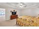 Spacious main bedroom featuring trey ceiling, ceiling fan, and adjoining bath at 2262 Silver Fox Ln, Buford, GA 30519