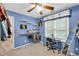 Bright blue walk-in closet with shelving and desk situated in front of window, great for storage at 2262 Silver Fox Ln, Buford, GA 30519