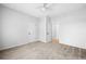 Bright bedroom features neutral carpeting, a ceiling fan, and a closet at 603 Spring Heights Se Ln # 6, Smyrna, GA 30080