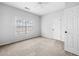 Bedroom features neutral carpeting, a ceiling fan, and a window with blinds at 603 Spring Heights Se Ln # 6, Smyrna, GA 30080