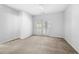 Bright bedroom features neutral carpeting, a ceiling fan, and access to a private balcony at 603 Spring Heights Se Ln # 6, Smyrna, GA 30080