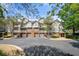 Exterior view of residences with a mix of brick and siding, complemented by private balconies and attached garages at 603 Spring Heights Se Ln # 6, Smyrna, GA 30080