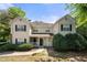 Inviting two-story home with a classic design, black shutters, and a charming front porch at 603 Spring Heights Se Ln # 6, Smyrna, GA 30080
