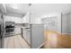 Modern kitchen features stainless steel appliances, white cabinets, and an open view to the dining area at 603 Spring Heights Se Ln # 6, Smyrna, GA 30080