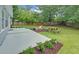 The backyard is fenced-in with a fire pit, picnic table, patio, and nice landscaping at 1080 Smoke Hill Ln, Hoschton, GA 30548