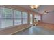 Bright breakfast nook features multiple windows and a door to the backyard at 1080 Smoke Hill Ln, Hoschton, GA 30548