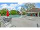 Beautiful community pool area with a mushroom fountain, lounge chairs, and seating tables at 1080 Smoke Hill Ln, Hoschton, GA 30548