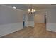 Dining room features modern lighting and wood flooring, perfect for Gathering dinners and entertaining guests at 1080 Smoke Hill Ln, Hoschton, GA 30548