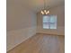 Cozy dining room boasts luxury vinyl plank flooring and classic chair rail at 1080 Smoke Hill Ln, Hoschton, GA 30548