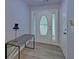 Inviting entryway features light grey walls and luxury vinyl plank flooring at 1080 Smoke Hill Ln, Hoschton, GA 30548