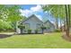 Well-maintained home with lush green lawn and mature trees in a quiet neighborhood at 1080 Smoke Hill Ln, Hoschton, GA 30548