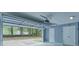 This garage features a working garage door, extra door, and a clean, finished interior at 1080 Smoke Hill Ln, Hoschton, GA 30548