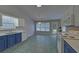 Modern kitchen featuring white appliances, two tone cabinets, and a breakfast nook at 1080 Smoke Hill Ln, Hoschton, GA 30548