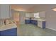 This kitchen features two-tone cabinets and a vaulted ceiling for a great look at 1080 Smoke Hill Ln, Hoschton, GA 30548