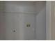 Laundry room with storage shelf and utility connections at 1080 Smoke Hill Ln, Hoschton, GA 30548
