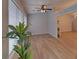 Bright sunroom area with neutral walls, ceiling fan and luxury vinyl plank flooring at 1080 Smoke Hill Ln, Hoschton, GA 30548