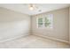 Inviting bedroom features carpet, ceiling fan, and a large window at 5605 Preserve Cir, Johns Creek, GA 30005