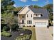 Traditional two-story home with well-manicured landscaping and a two-car garage at 5605 Preserve Cir, Johns Creek, GA 30005