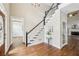 Inviting entryway with hardwood floors, staircase, and elegant decor, creating a warm welcome at 5605 Preserve Cir, Johns Creek, GA 30005