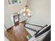 Grand foyer with a striking chandelier, hardwood floors, and a staircase at 5605 Preserve Cir, Johns Creek, GA 30005