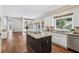 Gourmet kitchen with a large island, granite counters, stainless appliances and hardwood floors at 5605 Preserve Cir, Johns Creek, GA 30005