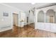 Bright room featuring hardwood floors, stylish built-ins, and a cozy office nook at 5605 Preserve Cir, Johns Creek, GA 30005