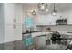 Stylish kitchen with white cabinets, granite countertops, stainless steel appliances, and a tile backsplash at 1329 Hidden Hills Pkwy, Stone Mountain, GA 30088