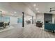 Spacious living area featuring an open floor plan, modern lighting, and stylish finishes throughout at 1329 Hidden Hills Pkwy, Stone Mountain, GA 30088