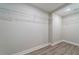 Corner view of an empty walk-in closet with hardwood floors and wire shelving at 1329 Hidden Hills Pkwy, Stone Mountain, GA 30088