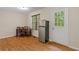 Eat-in kitchen features stainless steel refrigerator and an exit door to the back yard at 148 White Pine Ln, Temple, GA 30179