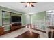 Comfortable living room featuring large windows and seamless access to the staircase at 148 White Pine Ln, Temple, GA 30179