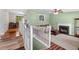 View of living room, highlighting the fireplace, ceiling fan, and natural light at 148 White Pine Ln, Temple, GA 30179