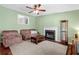Inviting living room features a cozy fireplace and plush, comfortable seating arrangements at 148 White Pine Ln, Temple, GA 30179