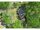 Aerial view of cottage-style home surrounded by green trees and lush yard at 1921 Hazelwood Se Dr, Marietta, GA 30067