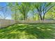 Spacious fenced backyard with lush green lawn, perfect for outdoor activities at 1921 Hazelwood Se Dr, Marietta, GA 30067