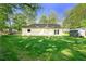 Cozy backyard scene with a home, a fenced in yard and shed at 1921 Hazelwood Se Dr, Marietta, GA 30067