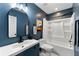 Bright bathroom featuring blue walls, white fixtures, and modern accents at 1921 Hazelwood Se Dr, Marietta, GA 30067